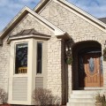 The exterior walls of a home outfitted with Beaver Creek Ledge stone veneer from Halquist's Ledge Collection.