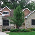 The exterior walls of a home outfitted with Beaver Creek Marsh stone veneer from Halquist's Blend Collection.