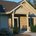 The exterior walls of a home outfitted with Beaver Creek Weatheredge stone veneer from Halquist's Ledge Collection.