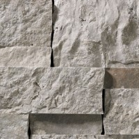 A grey stone veneer with a few lilac accents perfect for any hardscape idea on the exterior or interior of any home or landscape.