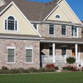 The exterior walls of a home outfitted with Chateau stone veneer from Halquist's Castlestone Collection.