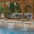 The wall of a water feature outfitted with Chilton Full Color stone veneer from Halquist's Ledge Collection.