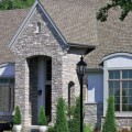 The exterior walls of a home outfitted with Chilton Ledge stone veneer from Halquist's Ledge Collection.