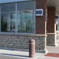 The exterior walls of a building outfitted with Fond Du Lac Rustic stone veneer from Halquist's Ledge Collection.