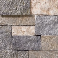 A grey and tan stone veneer with both warm and cool tones and a few rose-colored accents perfect for any hardscape idea on the exterior or interior of any home or landscape.