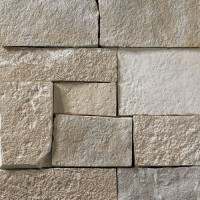 A light grey stone veneer with subtle tan and lighter grey accents perfect for any hardscape idea on the exterior or interior of any home or landscape.