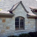 The exterior walls of a home outfitted with Ideal stone veneer from Halquist's Castlestone Collection.