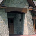 The exterior walls of a home outfitted with Kensington stone veneer from Halquist's Blend Collection.