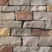 A grey, red, and tan stone veneer perfect for any hardscape idea on the exterior or interior of any home or landscape.