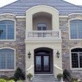 The exterior walls of a home outfitted with the Monarch stone veneer from Halquist's Castlestone Collection.