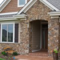 The exterior of a home outfitted with Rustic Strip stone veneer from Halquist's Blend Collection.