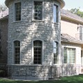 The exterior walls of a home outfitted with Smokey Mountain stone veneer from Halquist's Castlestone Collection.