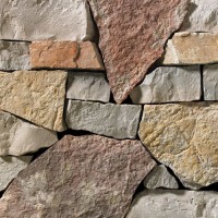 This stack ledgestone features light grey and tan tones complimented with a warm, red accent.