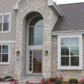 The exterior walls of a home outfitted with the Tamarack stone veneer from Halquist's Ledge Collection.