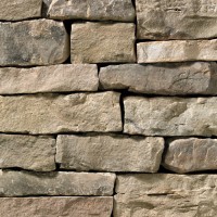 A brown-grey stone veneer with a slightly warm tone perfect for any hardscape idea on the exterior or interior of any home or landscape.