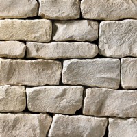 A grey stone veneer with a tumbled texture and a few tan accents perfect for any hardscape idea on the exterior or interior of any home or landscape.