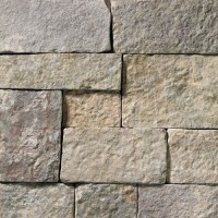 A tumbled cool-grey stone veneer with subtle tan accents perfect for any hardscape idea on the exterior or interior of any home or landscape.