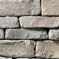 A light grey stone veneer with very subtle tan accents perfect for any hardscape idea on the exterior or interior of any home or landscape.