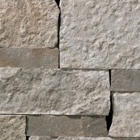 A grey stone veneer with darker grey accents and a few sparse, subtle tan tones perfect for any hardscape idea on the exterior or interior of any home or landscape.